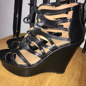 Black ankle strapped platform wedges